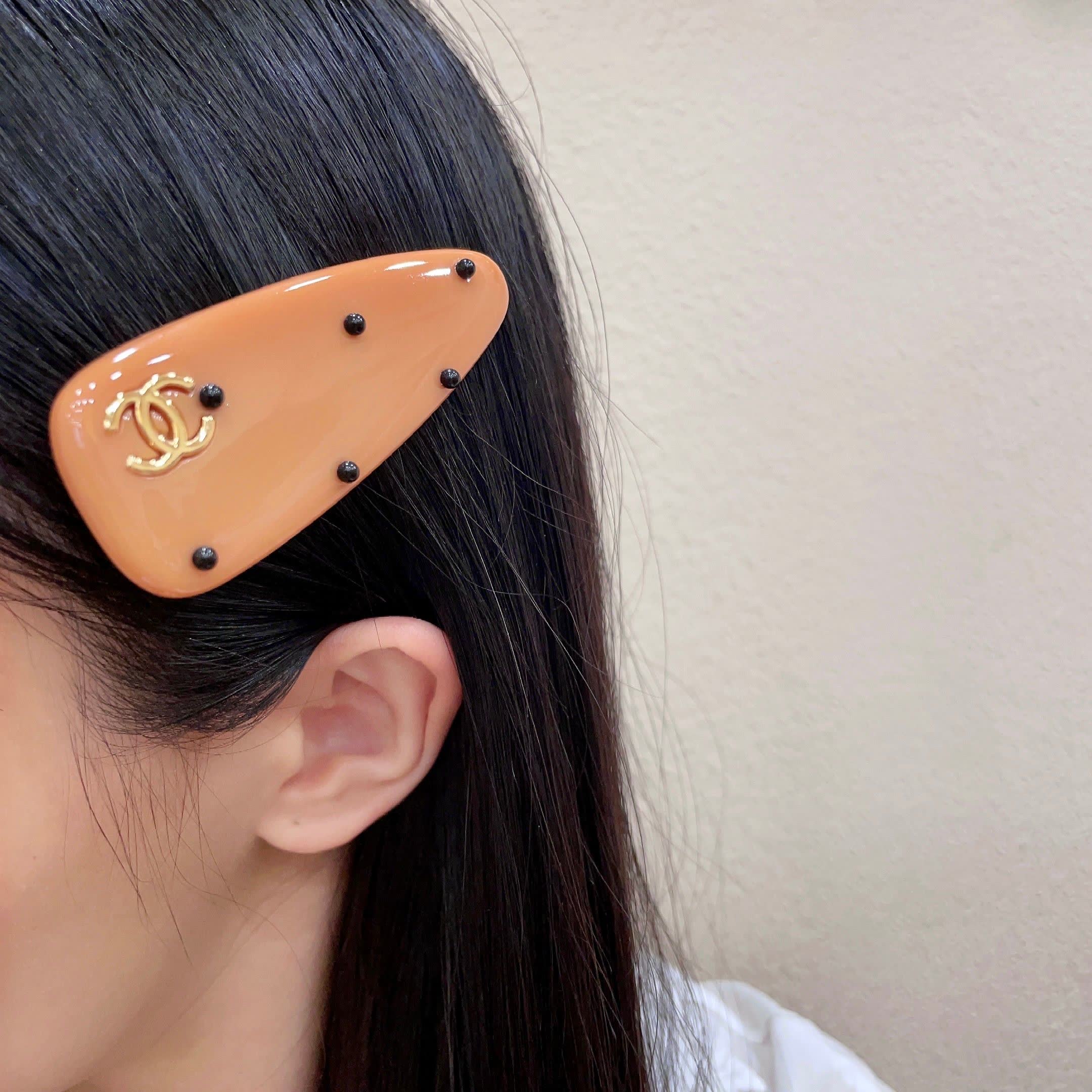 Chanel Orange Hair Clip with Black Dots